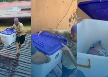 Penduduk letak bayi dalam kotak semasa banjir