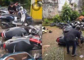 Parkir lagi depan rumah, motosikal diterbalikkan!