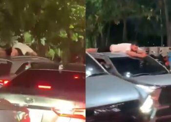 Bosan jalan jem, pelancong meniarap atas SUV 