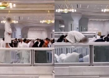 Jemaah solat atas penghadang kaca di Masjidil Haram