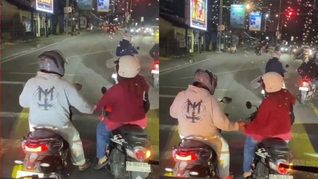 2 penunggang motosikal bermesraan tunggu lampu hijau